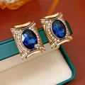 Macro di orecchini vintage in oro con pietre blu ovali e piccoli strass luminosi - Lega/Vetro/Perno in Argento S925 / Blu - Oro