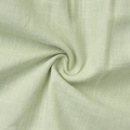 Detailed close-up of light green pleated cotton fabric with breathable weave texture - S / Green