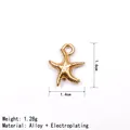 Close-up of golden starfish alloy pendant with 1.6cm x 1.4cm dimensions and weight - Starfish / Gold