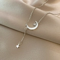 Elegant silver moon and star pendant necklace displayed on silk fabric background - Titanium Steel Silver Style (X472)