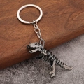Skelett Dinosaurier Schlüsselanhänger in Gunmetal mit Punk Totenkopf Stil Details - Gun Black Dinosaurier