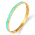 Close-up of gold stainless steel bangle featuring light blue enamel floral patterns - Gold Green
