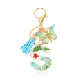Letter S keychain with green butterfly, tassel and floral resin letter pendant - Letter S