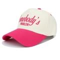 Two-tone trucker hat in white and pink with Somebody's Problem embroidery at 45-degree angle - Adjustable / Rose Red