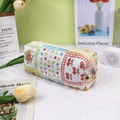 Detail of quilted cotton fabric patterns featuring cherry and floral patchwork design - Patchwork Flower Girl
