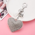 Sparkling silver heart keychain with white fringe tassel and rhinestones on pink display - Keychain + Heart + Small Tassel / White