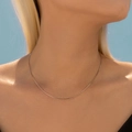 Minimalist S925 sterling silver thin link chain necklace worn on a female neck - 925 Silver / Snake Chain