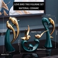 Three-piece ceramic love bird statues in dark green and gold finish for home decor - Love Birds Ceramic Set of 3