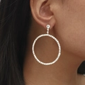 Large silver-colored hoop earrings with sparkling clear crystals worn by a model - Silver Large Hoop DTE1516157S