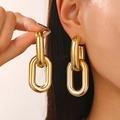 Close-up of gold double linked hoop earrings worn by a model in punk hip-hop style - Gold Double Ring Stud Earrings (K-631)