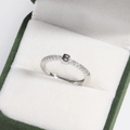 Macro view of adjustable silver letter B ring with small crystals in a green velvet jewelry box - White & Gold Style B