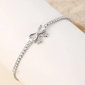 Silver bow bracelet with water-drop zircons and pave-set stones in a tennis chain design - White Butterfly A - Silver