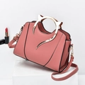 Dusty pink PU leather handbag featuring unique gold cat ear metal handles and a long strap - Pink