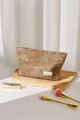 Close-up of brown linen cosmetics bag with exquisite floral embroidery and zipper - Large / Brown