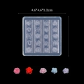 Detail view of square silicone mold for 3D rose flower nail art with colorful resin samples - Rose Collection 04