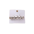 Silver spring hair clip featuring five polished metallic spheres on display card - Silver Round