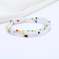 Detail of colorful beaded multi-layer waist chain with white and mixed vibrant beads - 80cm / White/Multi-color Accents