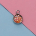 Detailed macro view of a 12mm stainless steel pendant with orange sequins and resin finish - Orange Gold Sequin Style (10)