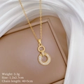 Detailed macro of gold necklace with interlocking rings and white cubic zirconia accents - Gold Interlocking Double Ring Necklace (D251)