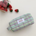 Close-up of a green quilted plaid cosmetic bag with a tulip patch and floral embroidery - Slim Style / Dark Green Plaid