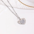 Macro detail of silver heart pendant with faux pearl inlays and irregular metal texture - Pearl Inlay Heart Necklace / Silver