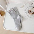 Grey ribbed mid-calf socks with vintage fabric label and button detail in tray - One Size / Gray