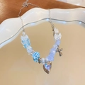Detail of sweet beaded bracelet featuring silver bow charms and a blue rhinestone heart - Blue Heart Necklace
