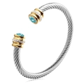 Silver twisted cable cuff bracelet with golden ends and sky blue round gemstone - December (Blue Topaz Zirconia)