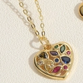 Macro shot of gold heart pendant necklace inlaid with vibrant colorful zircon gemstones - Colorful Zirconia Heart (XL2638-1)