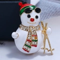 Macro detail of cartoon skiing snowman brooch with colorful enamel and sparkling rhinestones - WBR091 White KC Gold Snowman