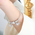 Silver steel cable bracelet featuring sparkling heart pendants and cubic zirconia beads - Steel (Z258)