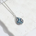 Silver teardrop evil eye necklace with blue rhinestones on natural white stone base - Silver Water Drop