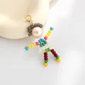 Handmade beaded doll pendant with pink pearl head and colorful limb beads on lobster clasp - Gold