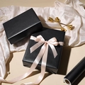 Matte black gift wrapping paper roll with elegant pink satin bow on premium gift boxes - 43CMx5M / Black