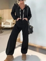 Solid black long sleeve hooded jumpsuit with white drawstrings and side pockets - S / Top And Bottom / Black
