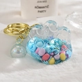 Blue acrylic cat paw keychain with colorful floating beads and golden ring detail - Bead Paw Style / Blue