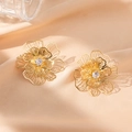Elegant gold-tone cutout flower stud earrings featuring a sparkling central cubic zirconia - Curved Flower