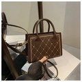 Detail of vintage coffee brown crossbody bag with heart embroidery and quilted stitching - Brown