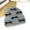 Gray knitted beanie for women featuring six black velvet bows for a sweet autumn look - Medium Grey