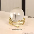 Modern crystal ball ornament with a golden geometric metal stand for desk decoration - 7145A-02