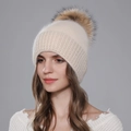 Women's cream knit beanie with a fluffy brown raccoon fur pompom for winter warmth - Beige