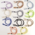 Adjustable woven stone holder necklaces in eleven vibrant colors on a clean background - Necklace / White