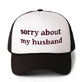 Close-up of sorry about my husband embroidery on breathable mesh trucker hat - One Size / Black