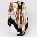 Detail of baroque saddle print silk scarf featuring golden equestrian chains and emblems - 90x90cm / Black (D9202)