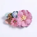 Detailed macro of fabric flower hair clip with pearls and rhinestones decoration - Style 5 (Pink & Blue Multi-Flower)
