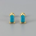 Macro detail of gold geometric screw stud earrings with emerald-cut turquoise stone - Rectangular Screw Back / Turquoise Gold Color