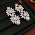 Elegant vintage butterfly earrings with layered petals and white pearls in silver finish - Steel Pin Silver Flower Pearl Crystal Tassel Earrings
