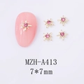 Detailed 7x7mm gold star nail art charms with pink zircon on manicured nails - Golden Starburst Pink Rhinestone (A413)
