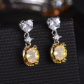 Elegant silver heart earrings with an oval yellow main stone and white accents - Yellow Diamond Pair Of Led-123