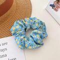 Light blue scrunchie with yellow floral pattern for ponytails in soft fabric finish - Small Floral Blue
